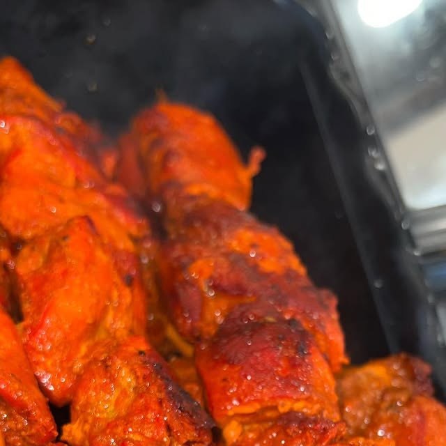 Chicken kebabs fresh off the grill at Dyckman Cafe and Grill