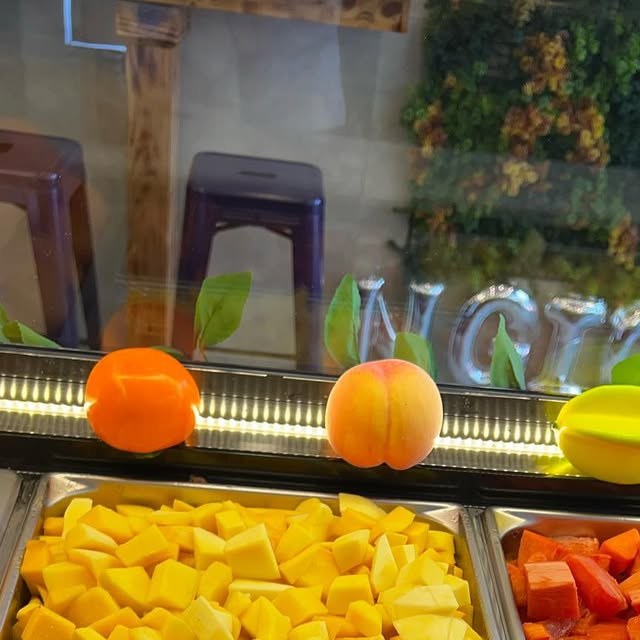 Fresh-cut mango and papaya at Dyckman Cafe and Grill